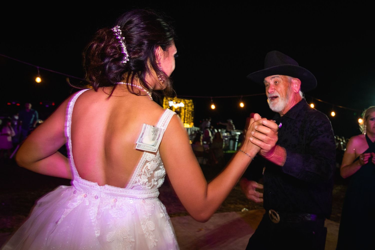 Dancers share a moment on the dance floor during an evening celebration.