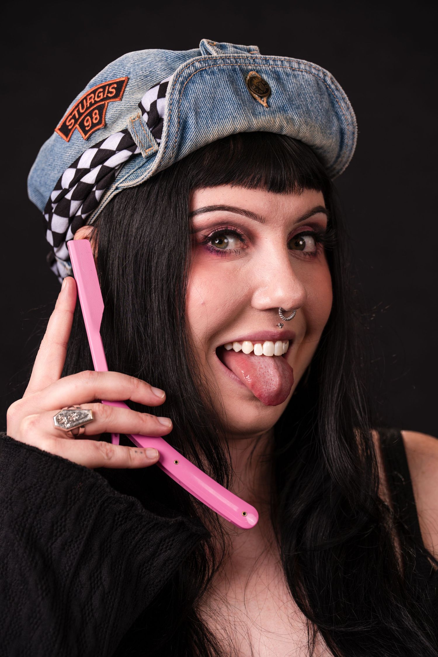A series of playful expressions shown while holding a pink butterfly knife against a dark background.