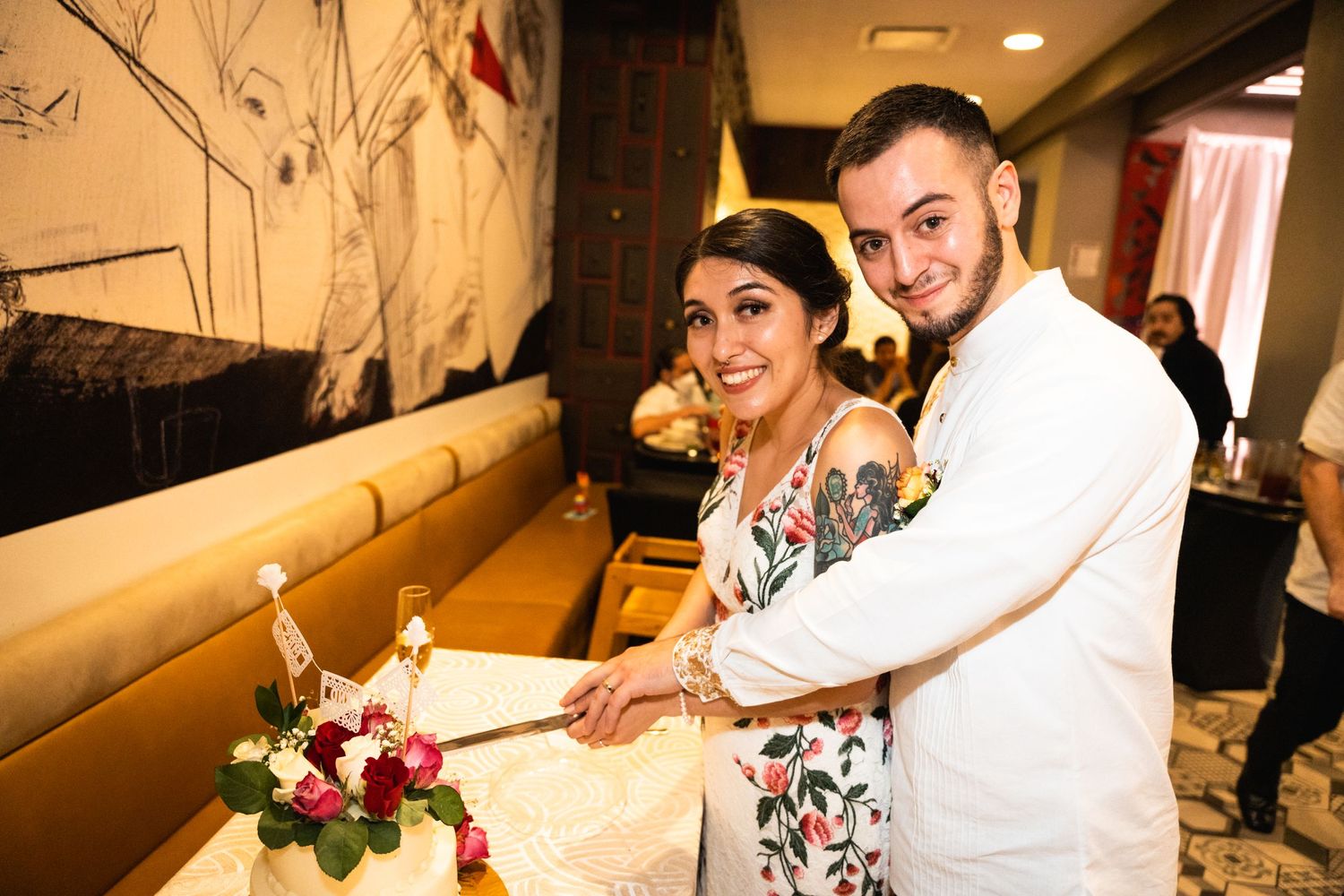 Reception celebration with guests at table signing guestbook.