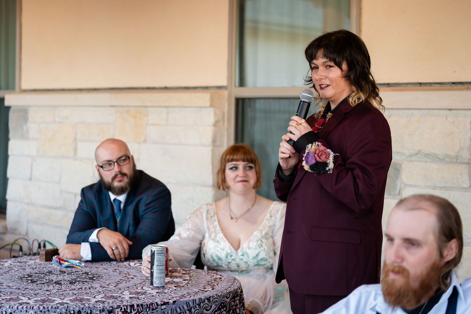 A series of candid moments from a wedding celebration showing guests interacting at tables and during reception events.
