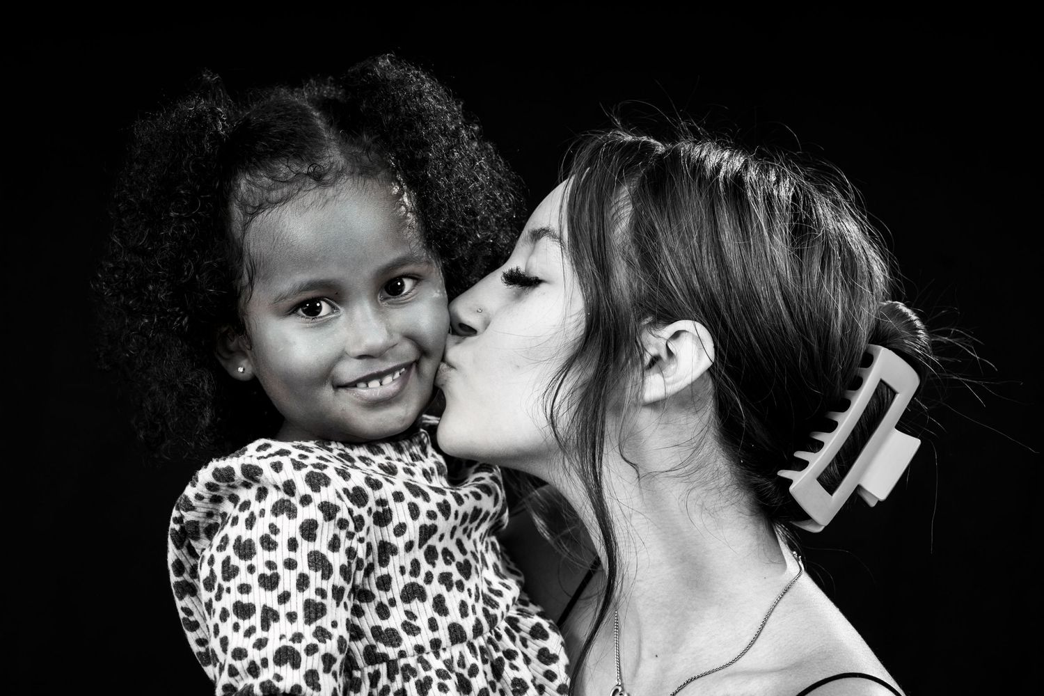 Sweet black and white photo capturing a tender family moment.