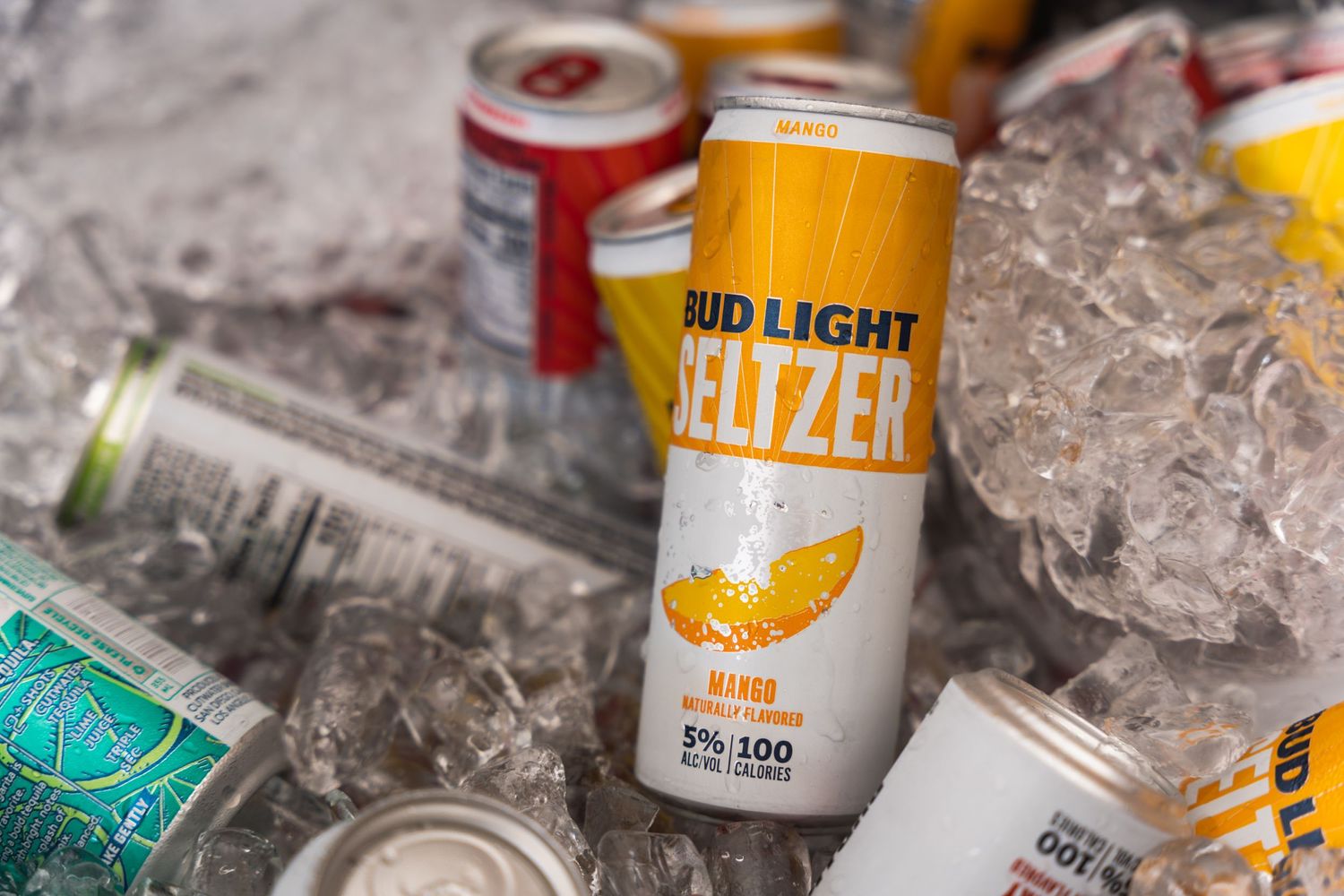 Bud Light Seltzer cans chilling in crushed ice.
