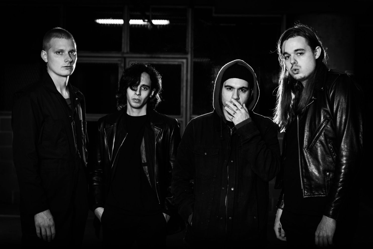 A black and white collage of performers in dark clothing against black backgrounds.
