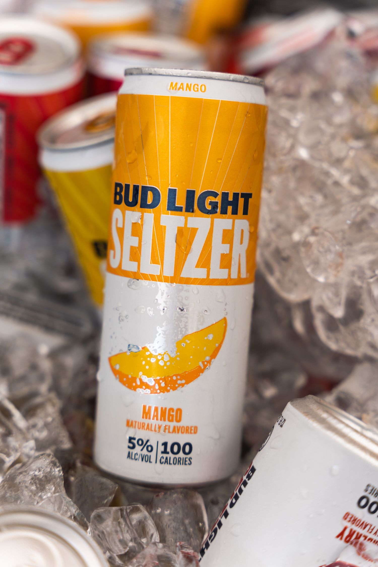 A mango-flavored Bud Light Seltzer can nestled in ice.