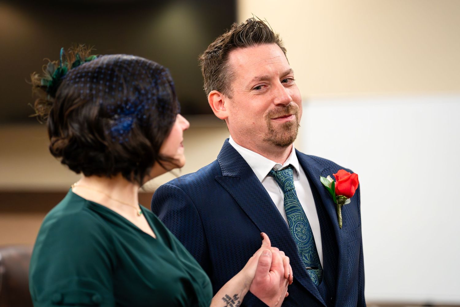 A happy couple exchanges vows during their courthouse marriage ceremony.