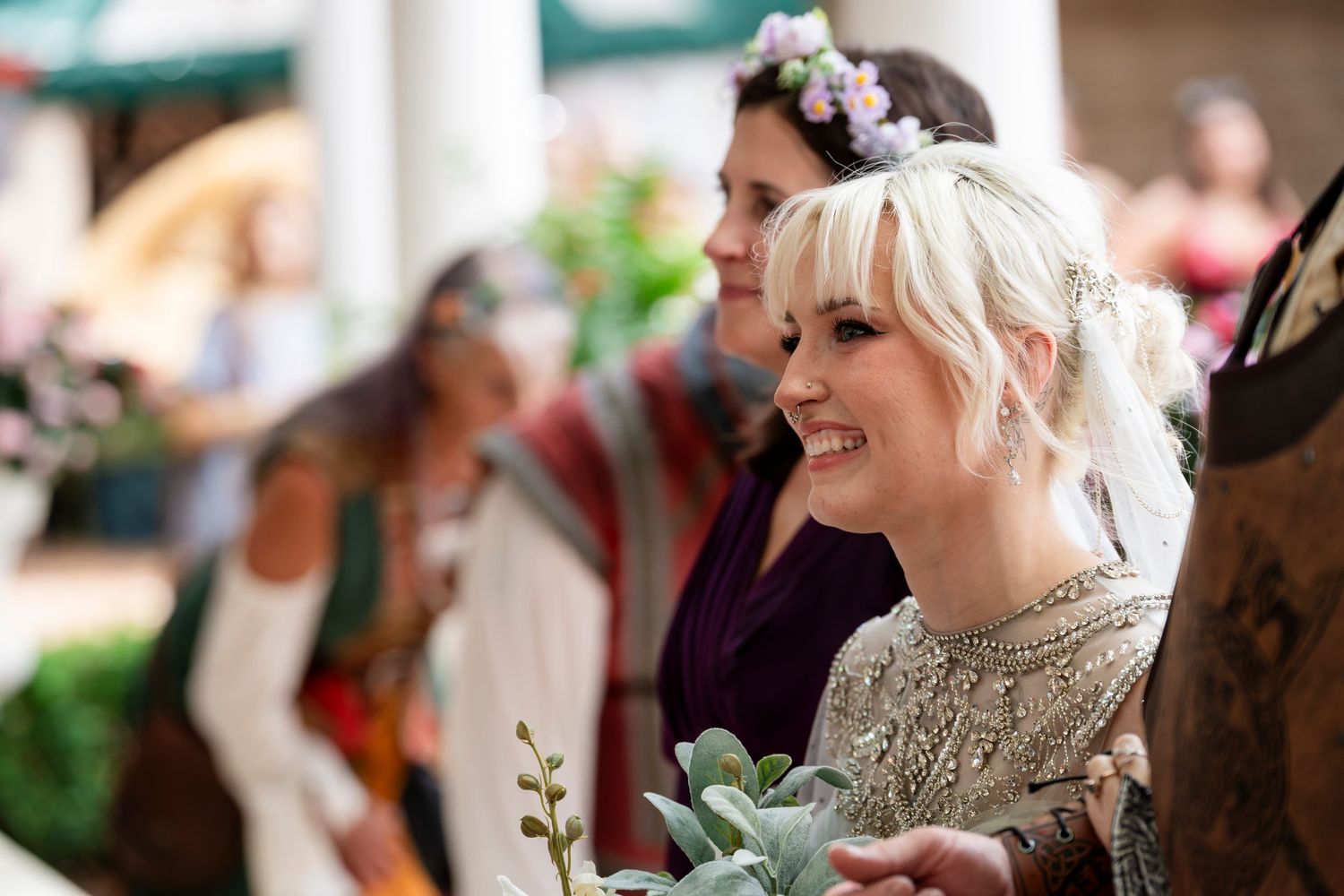 A collection of candid wedding reception photos showing guests smiling and celebrating at tables.