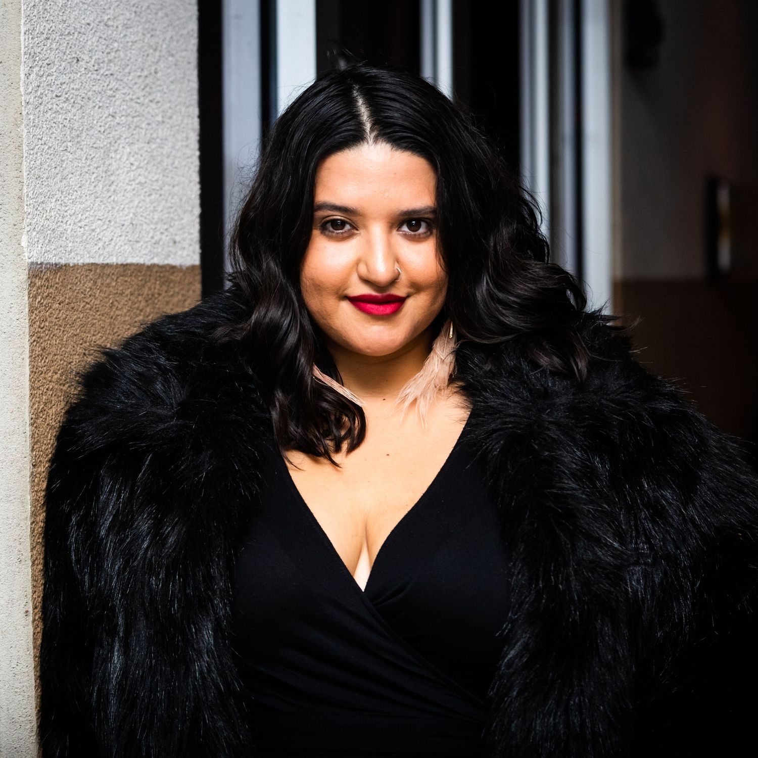 Portrait of a performer in a black dress.