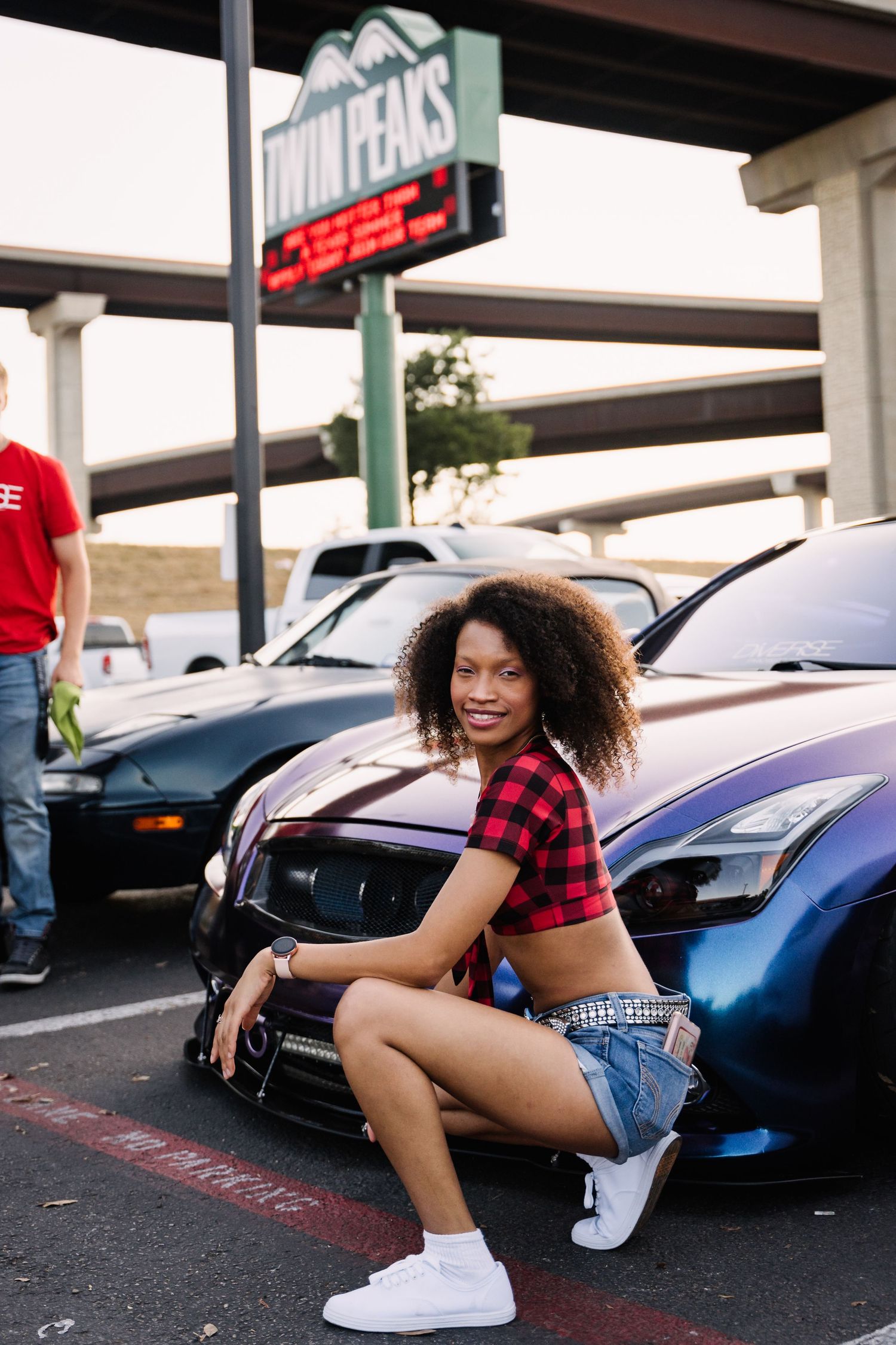 Red and blue sports cars gathered at a car meet in front of Duncan's restaurant.