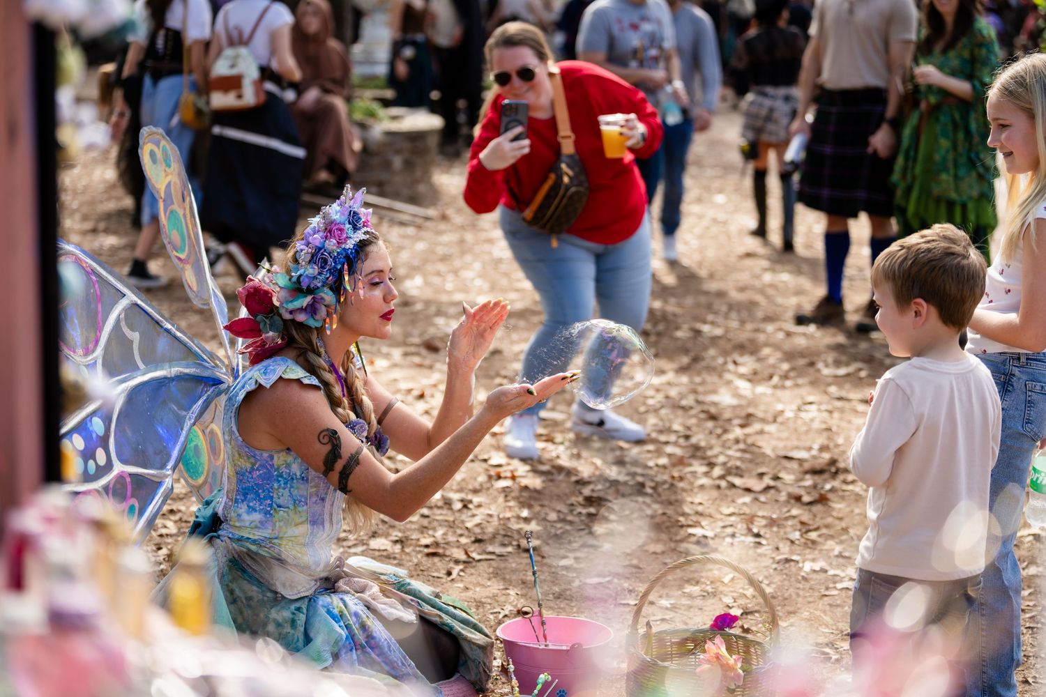 Children participate in an outdoor Easter egg hunt activity with colorful plastic eggs scattered on the ground.
