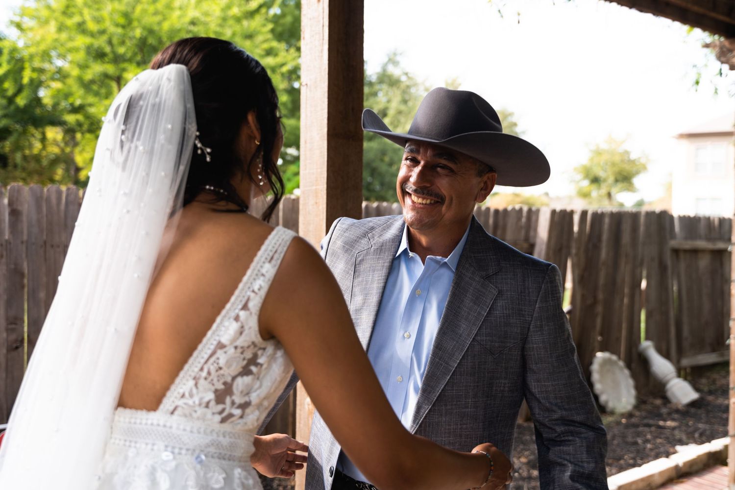 A tender moment captured between two people outdoors during a wedding.