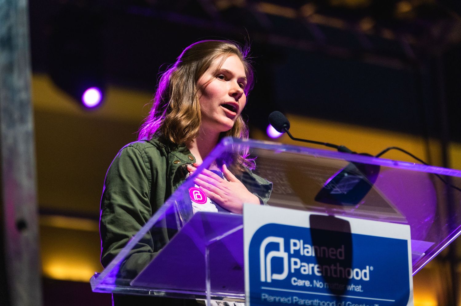 Speaker delivers remarks at podium with Parenthood organization logo visible.