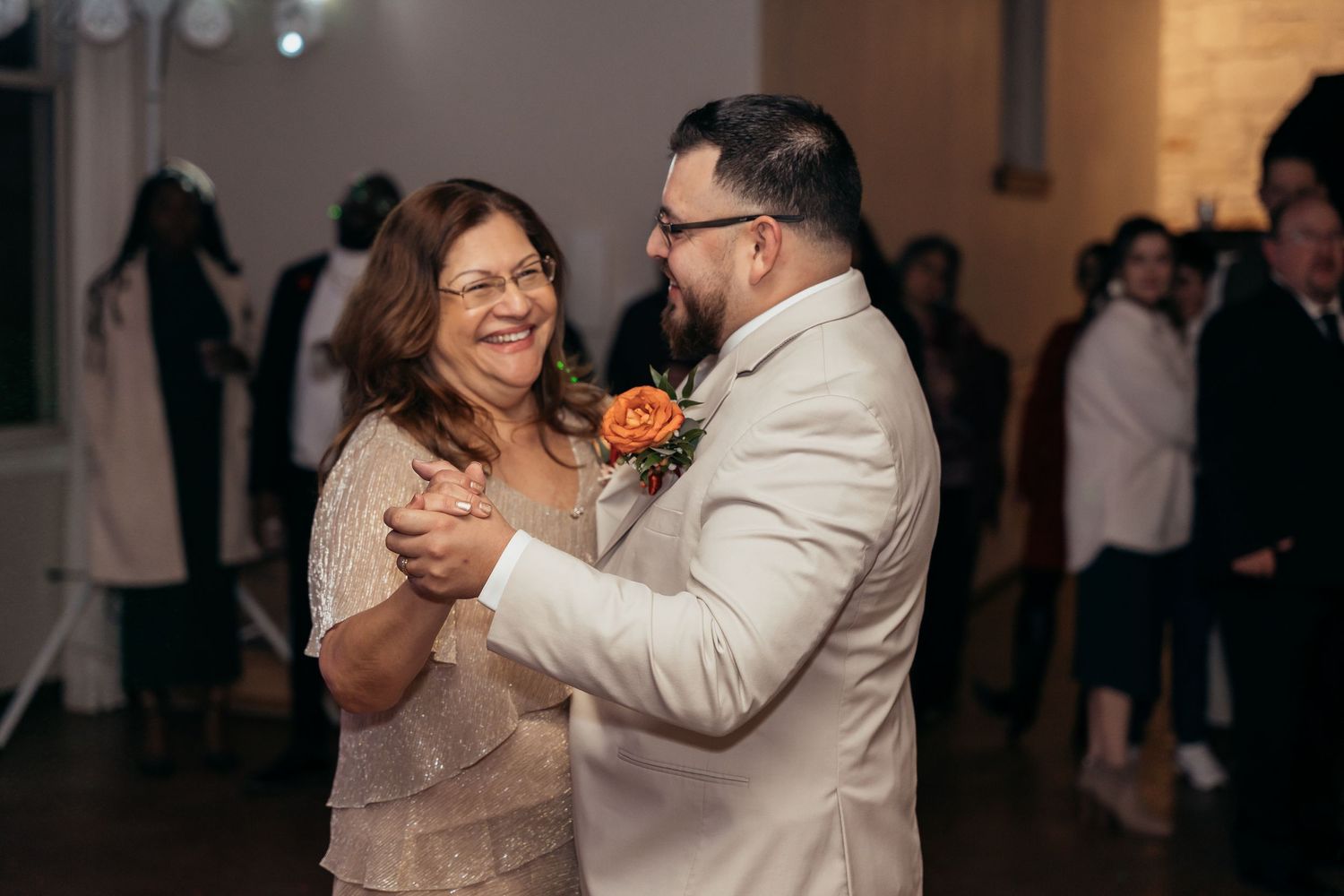 Couple sharing a joyful dance moment during their wedding celebration.