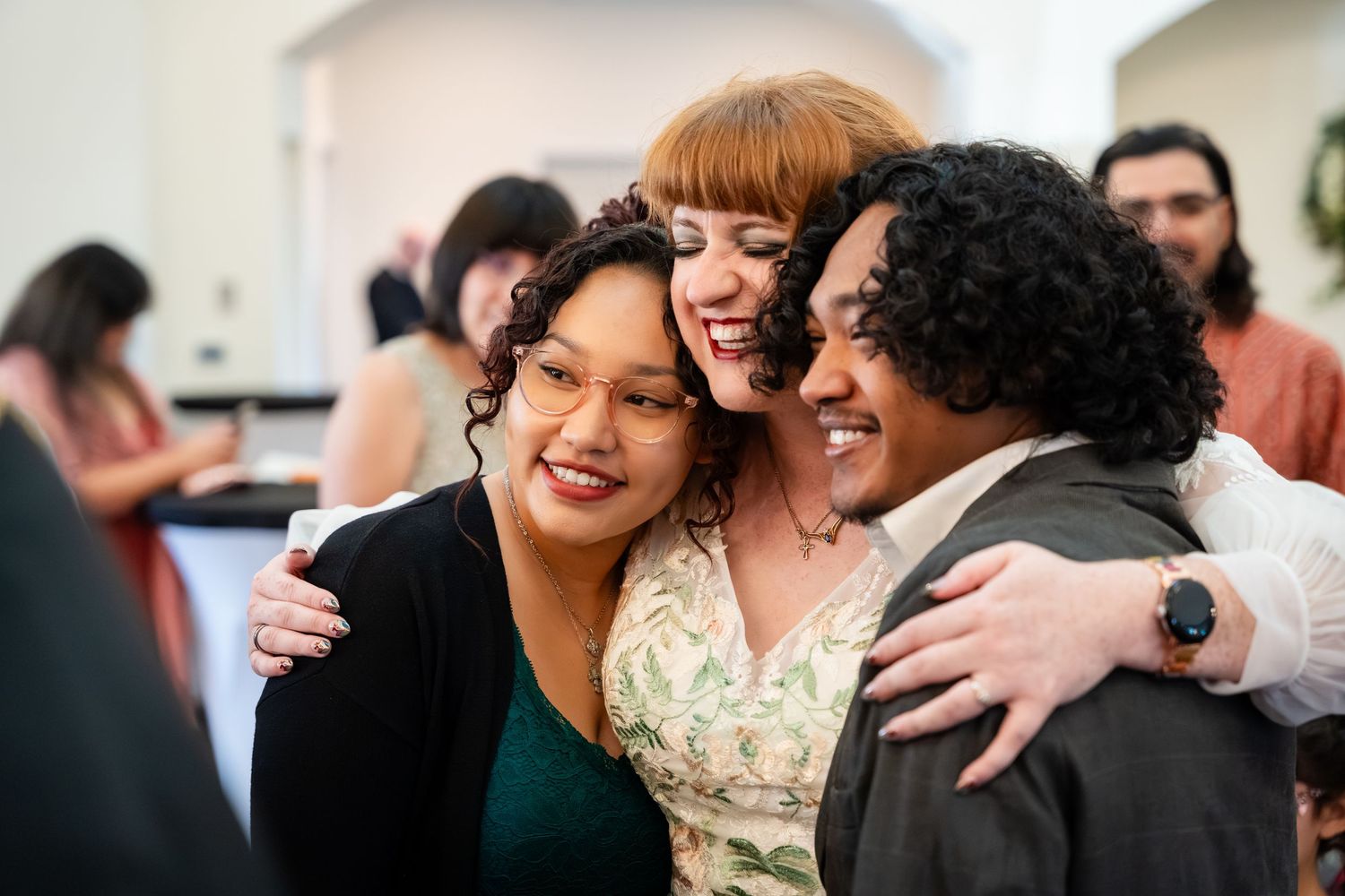 A series of candid moments at a wedding celebration showing guests laughing and embracing during the festivities.
