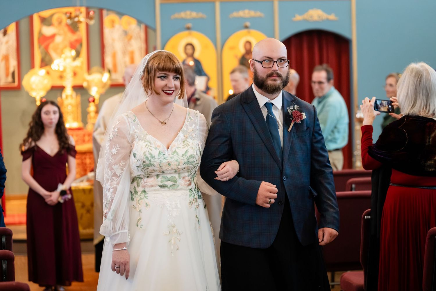 A collection of wedding reception photos showing guests mingling and dancing in an elegantly decorated venue.