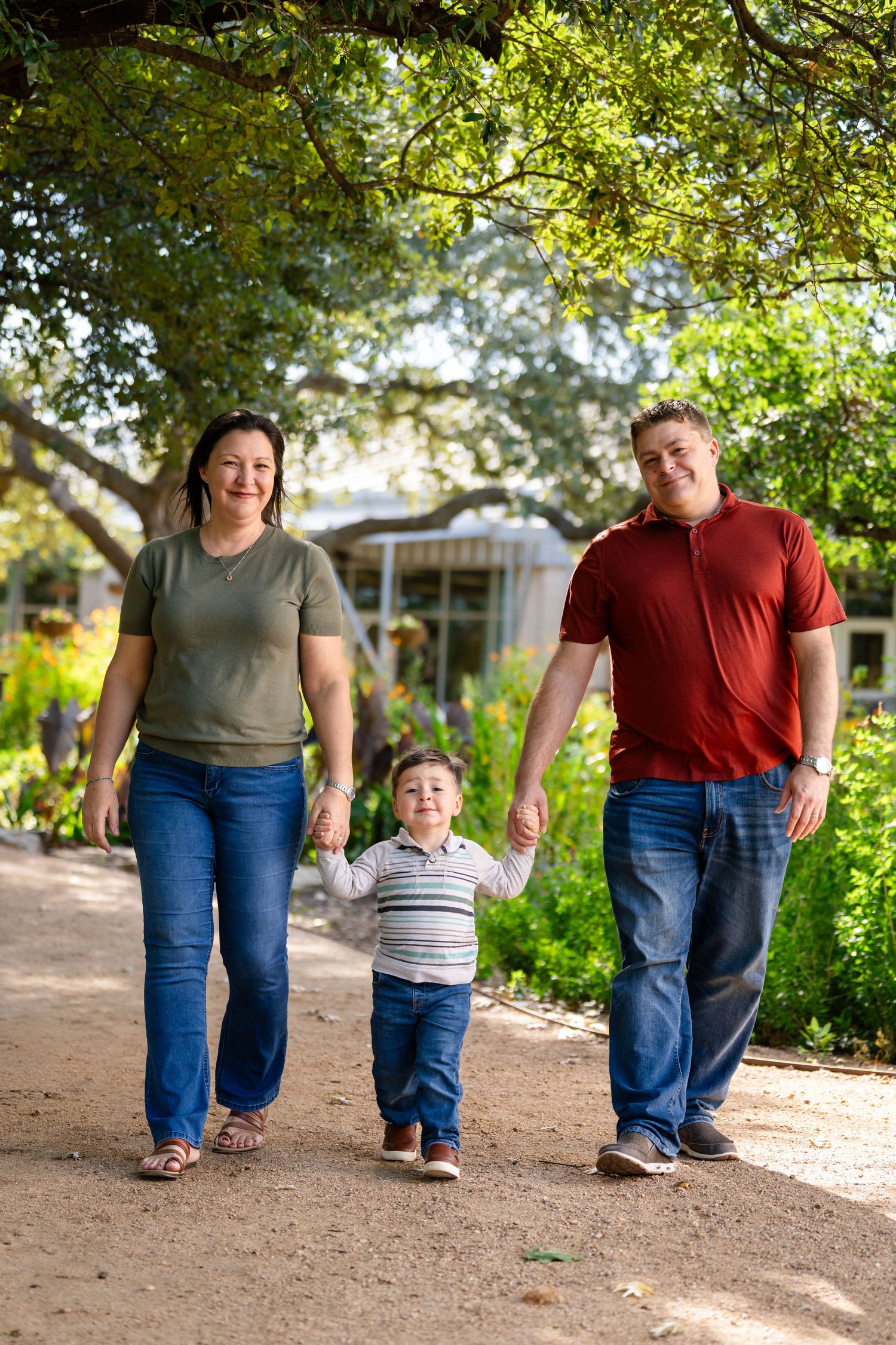A series of candid walking shots showing people strolling together on a dirt path under green trees in natural lighting.