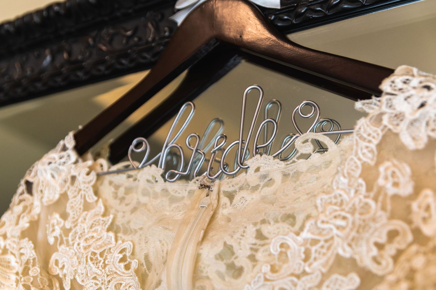 Custom bride wedding dress hanger with delicate lace detail shown in close-up.