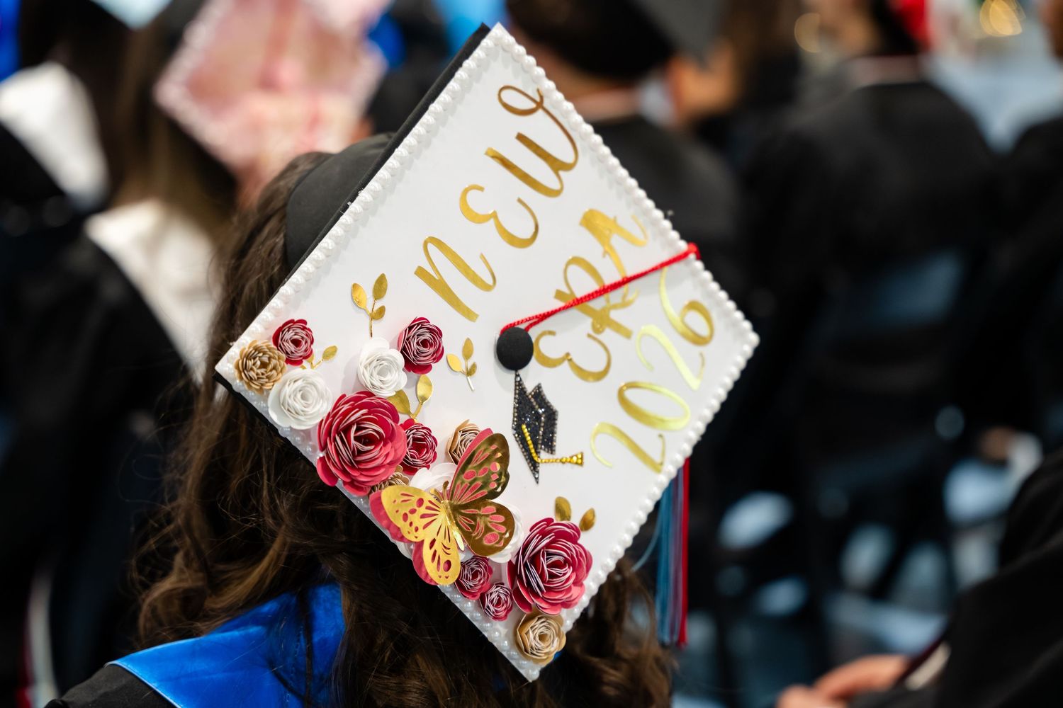 Decorated graduation cap with floral design and 