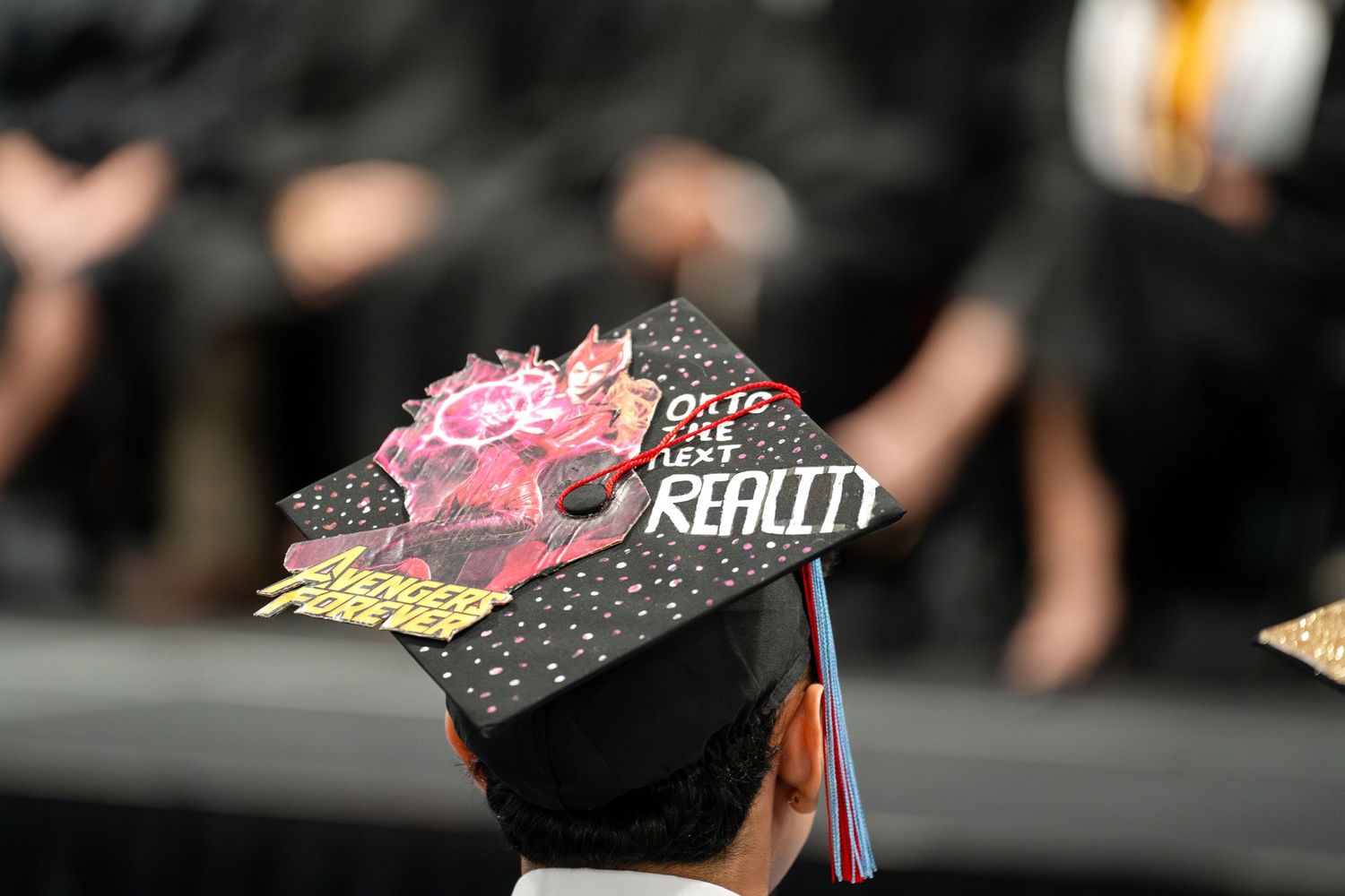 Decorated graduation cap with custom artistic design and text.
