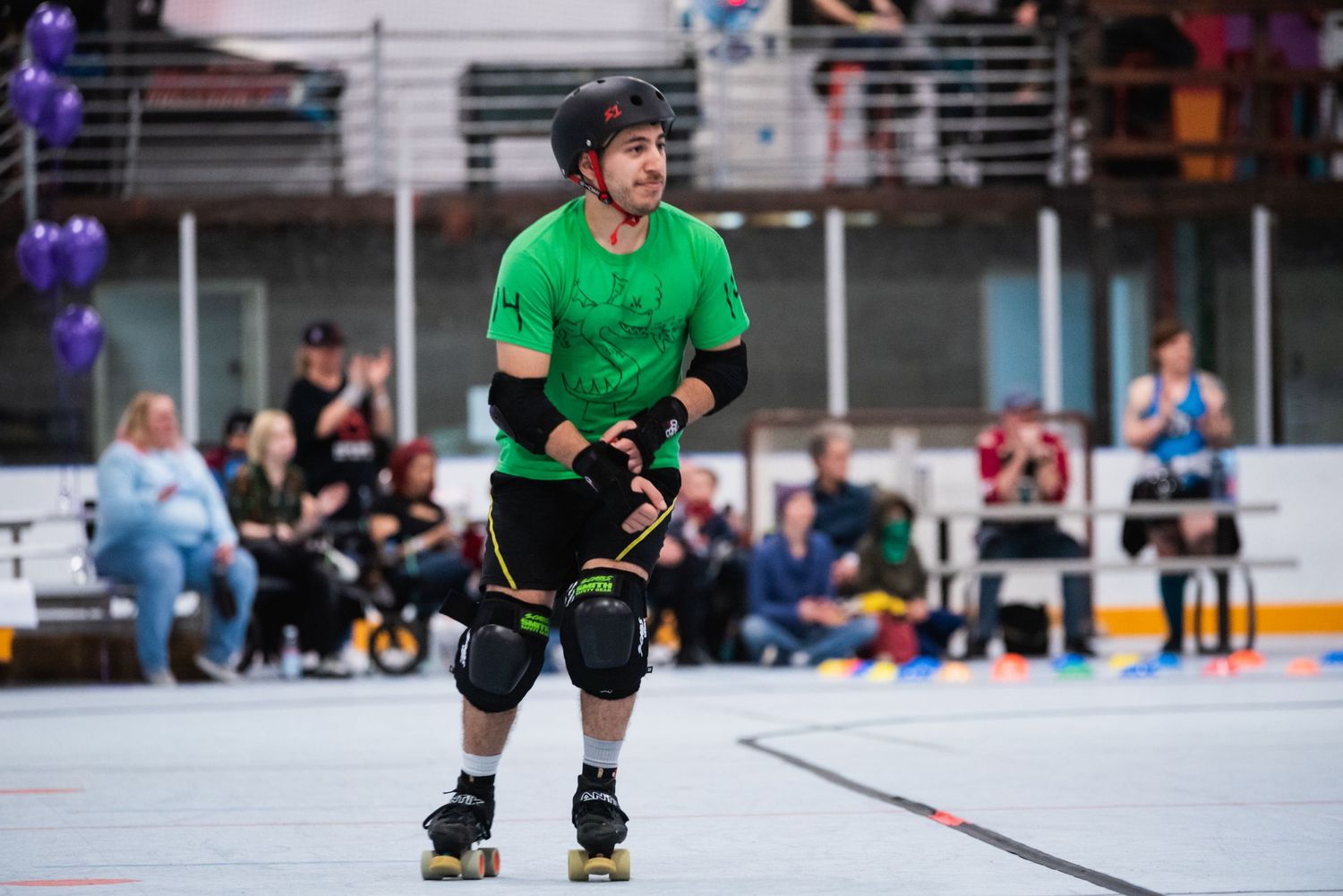 Roller derby player in bright green uniform skating on indoor rink during match.