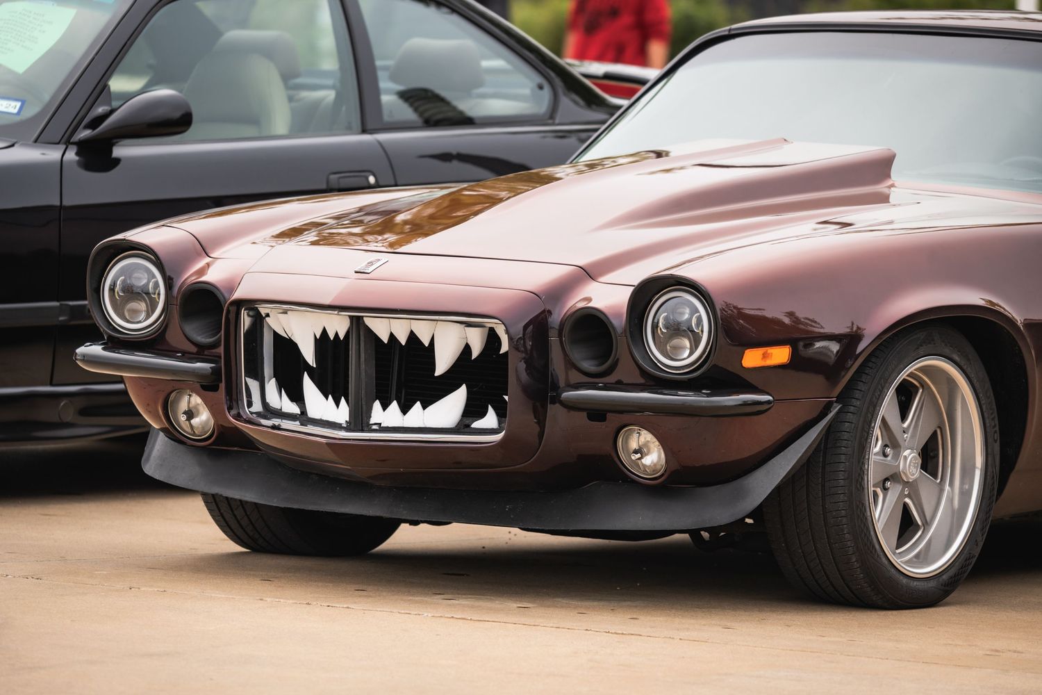 Custom brown Camaro with unique shark-teeth style front grille modification.