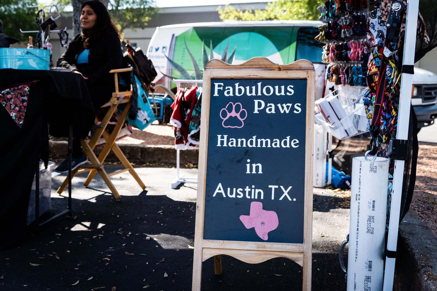 Outdoor market stall with 'Fabulous Paws' handmade in Austin TX sign displayed.