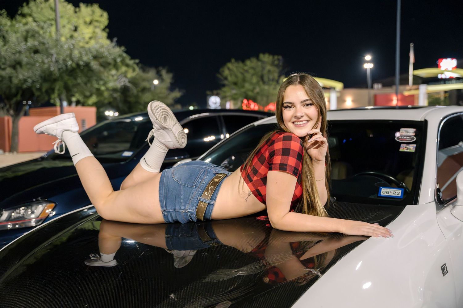 Casual lifestyle photoshoot at a nighttime car meet.