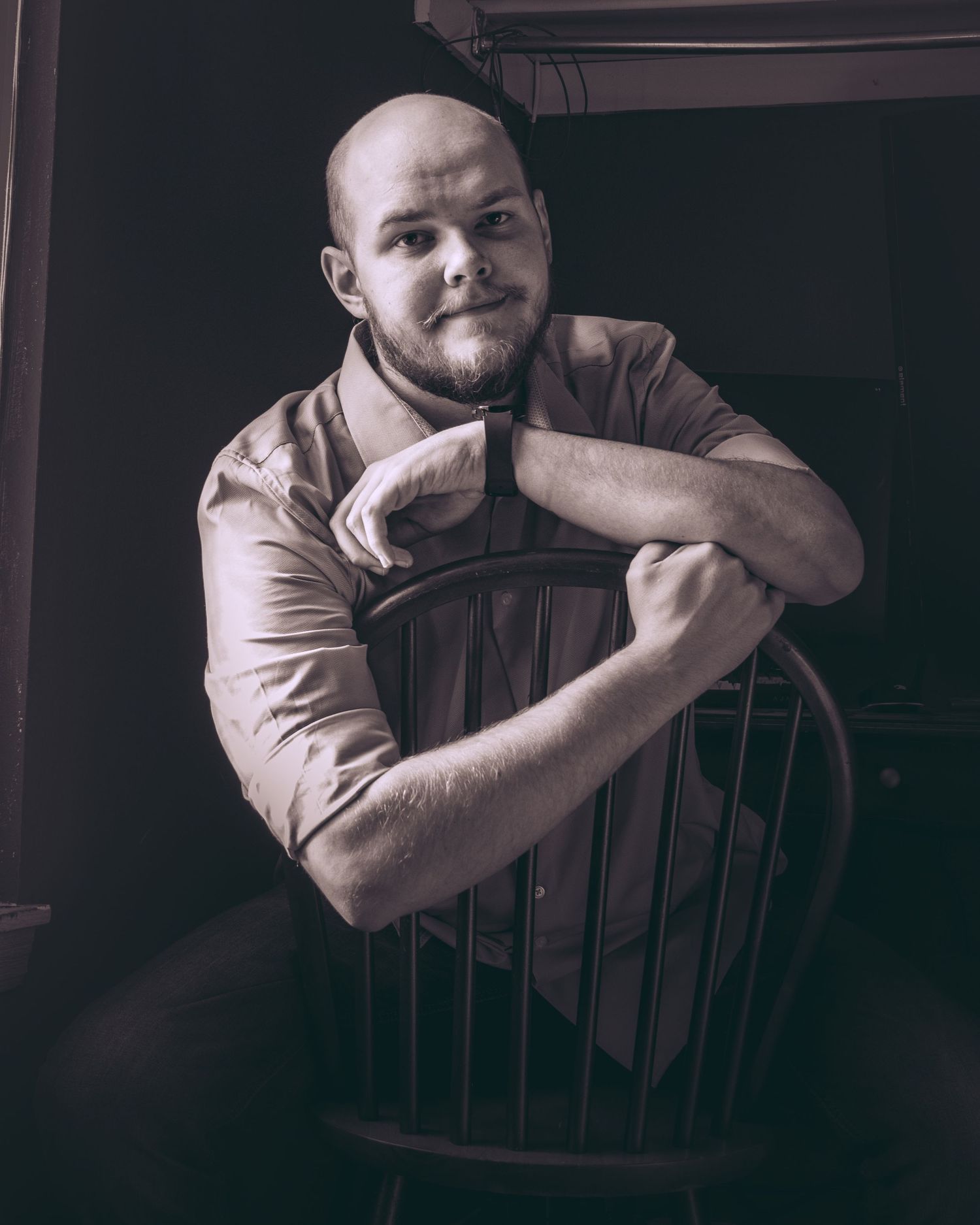 A sequence of dramatic black and white portraits showing a person posing thoughtfully in front of a dark background.