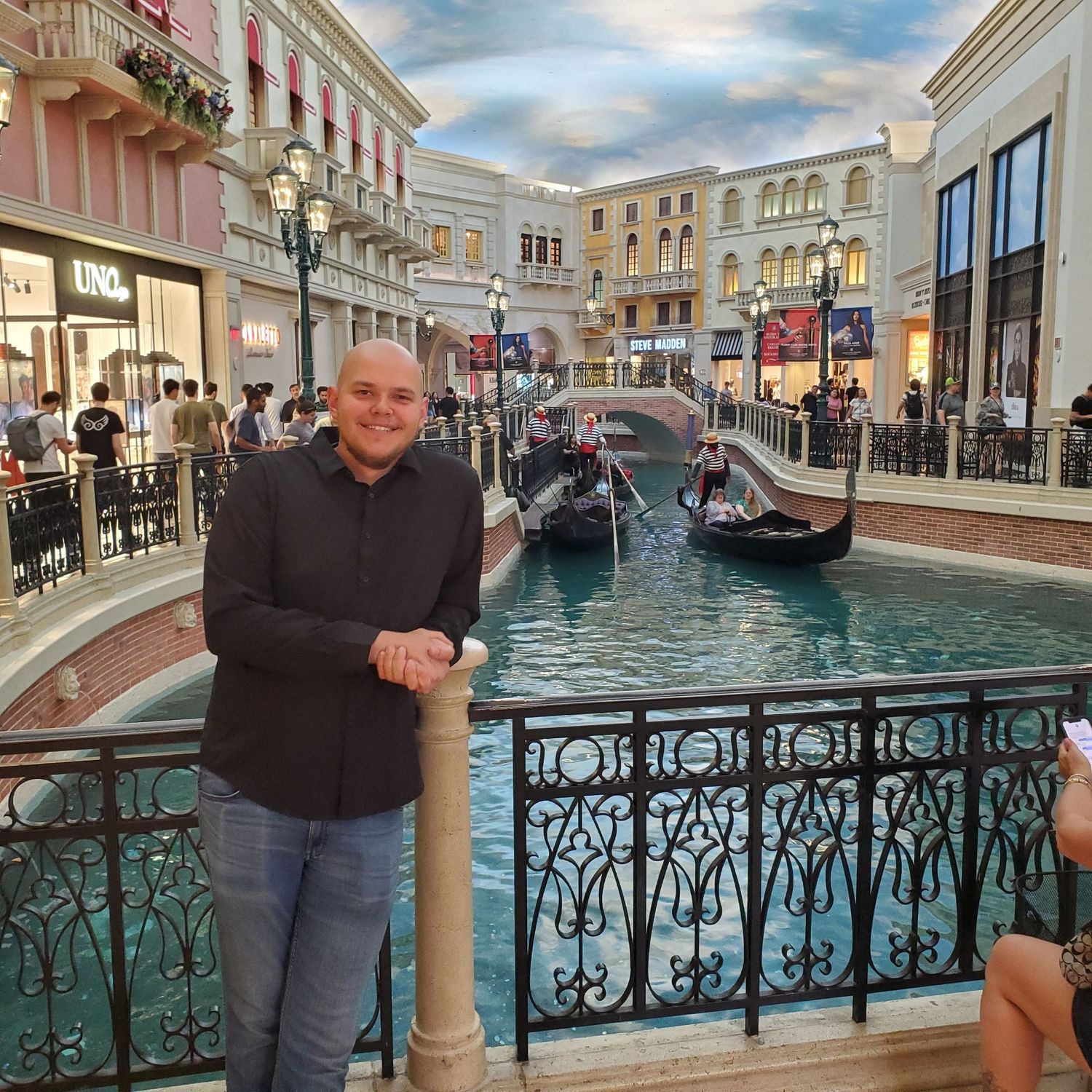 Indoor canal with gondolas at a Venetian-style shopping mall.