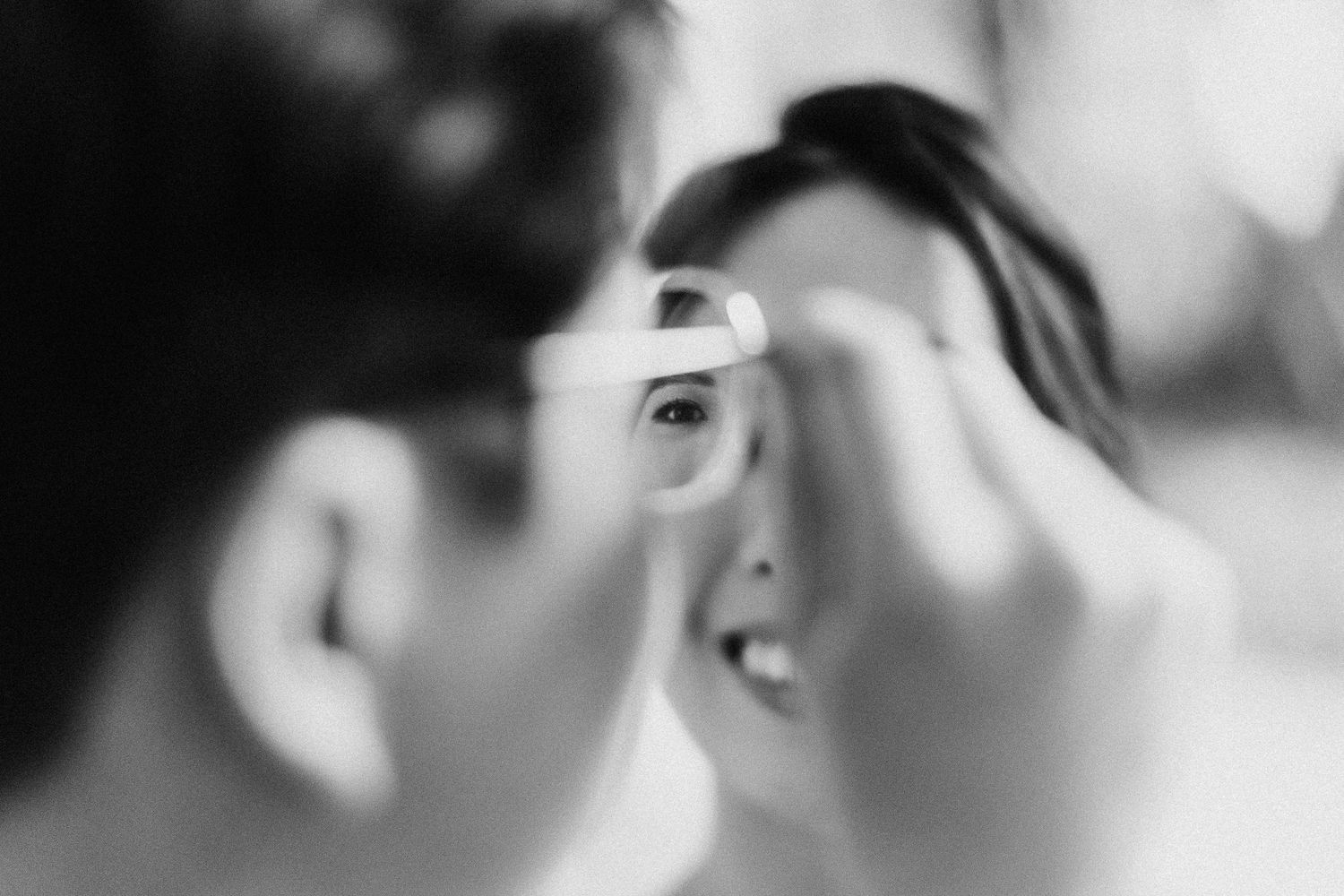 Close-up shot of wedding makeup application in soft focus.