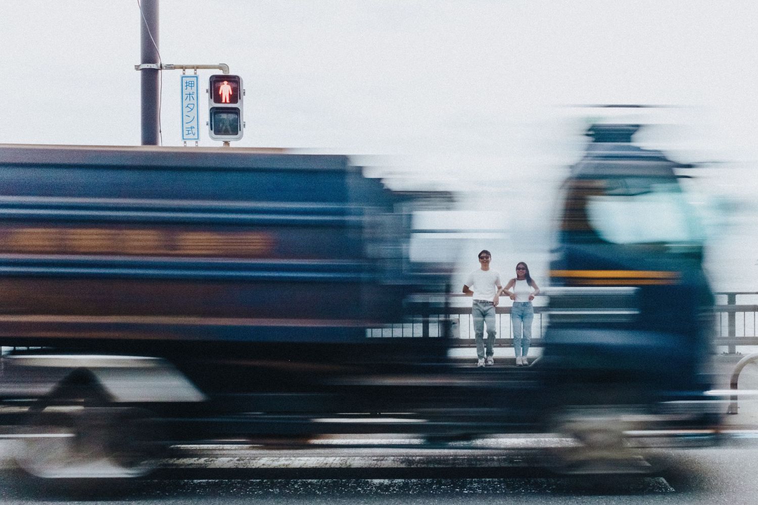Motion blur of passing vehicles creating abstract streaks of blue and white colors.