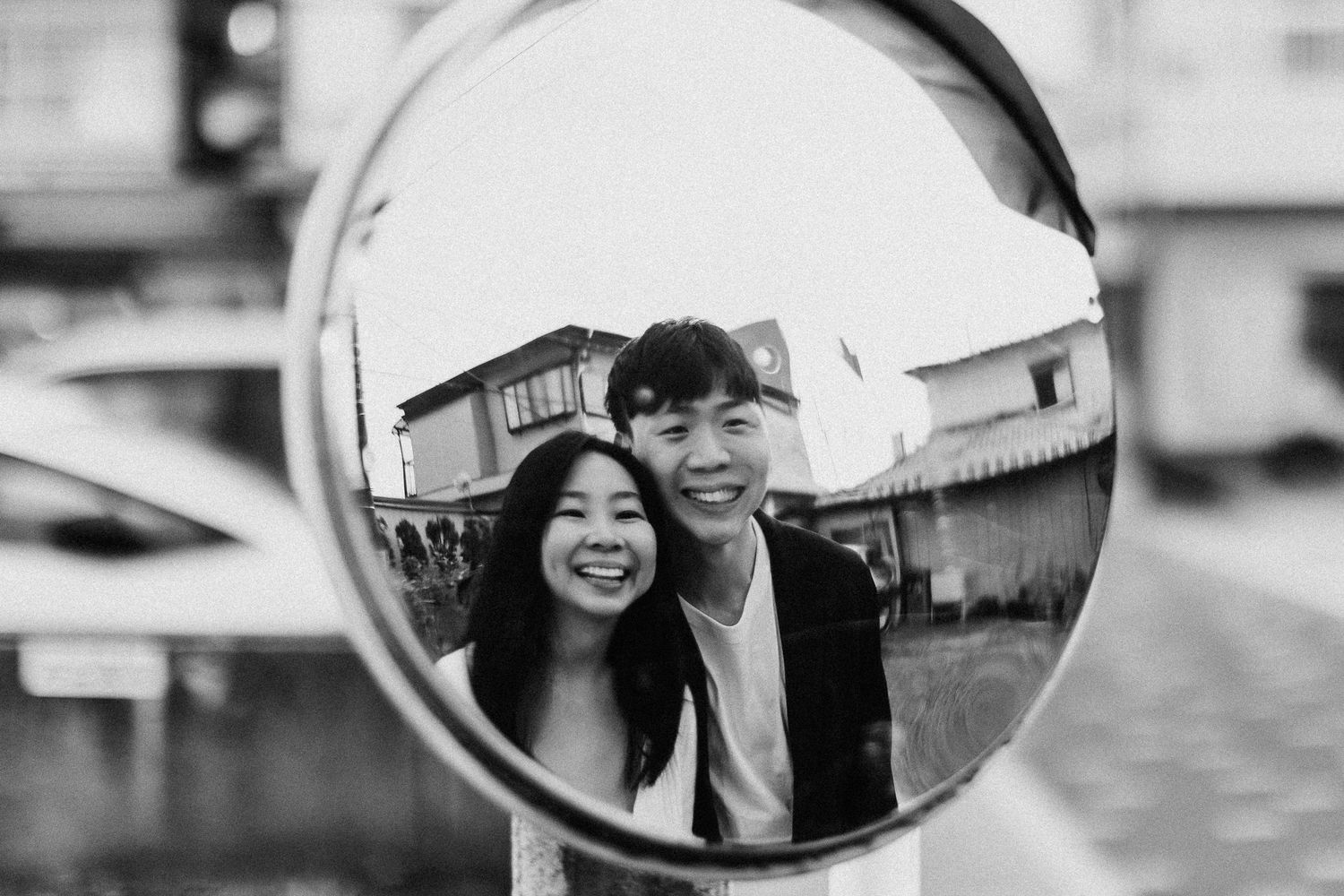 Black and white reflections in side-view mirrors capture artistic moments.
