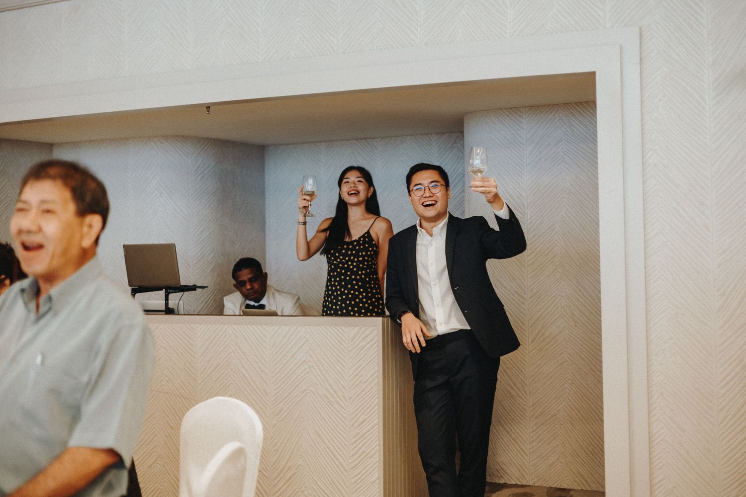 Group of wedding guests participating in an interactive party game or dance.