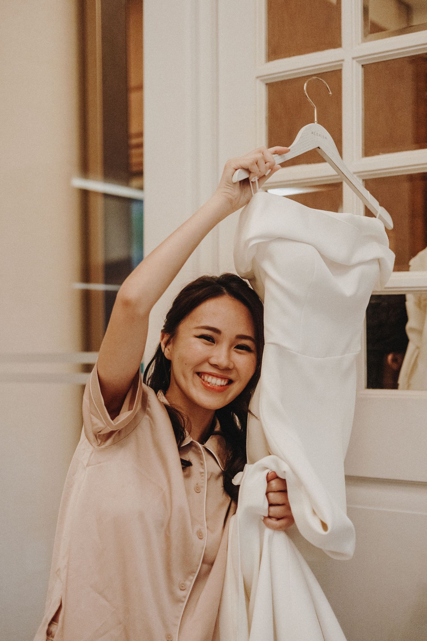 Joyful moments captured in vintage-toned portraits with white fabric creating movement and playful expressions.