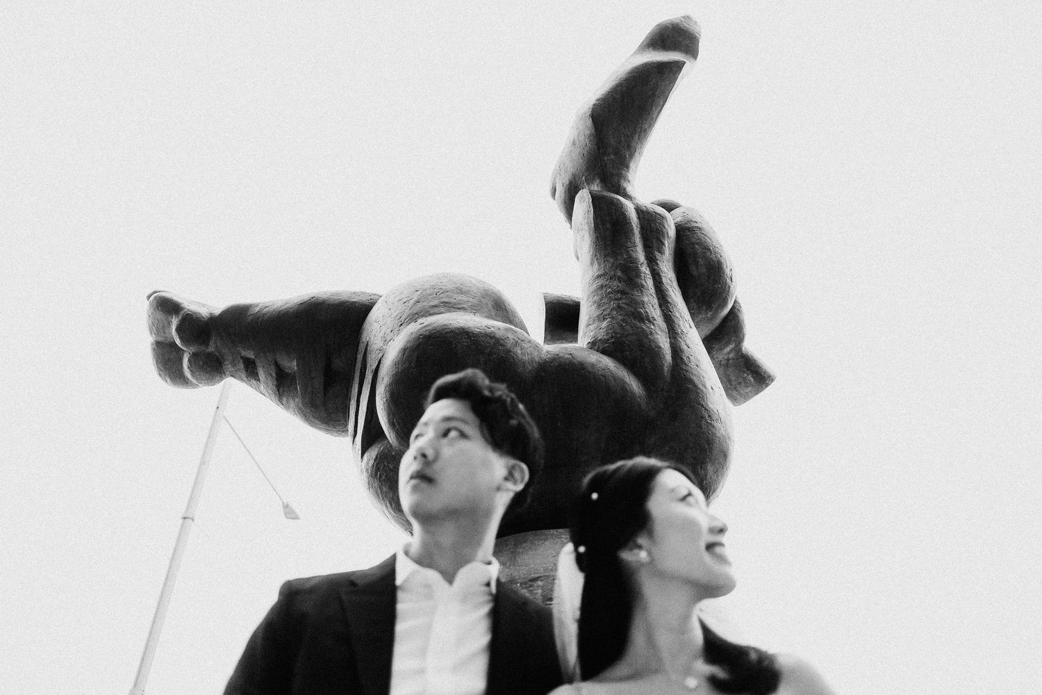 Artistic black and white engagement photos with dramatic lighting and poses.