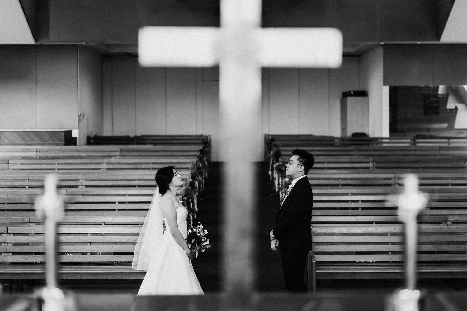A series of black and white wedding photos showing moments inside a church and formal ceremony.
