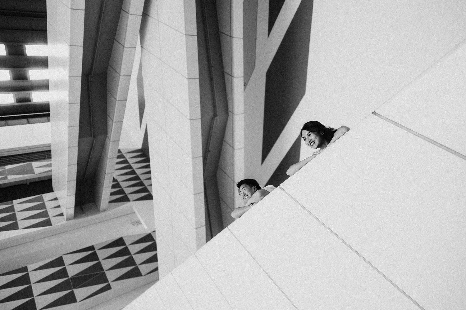 Angular architectural design elements create dramatic shadows and shapes in a modern building.
