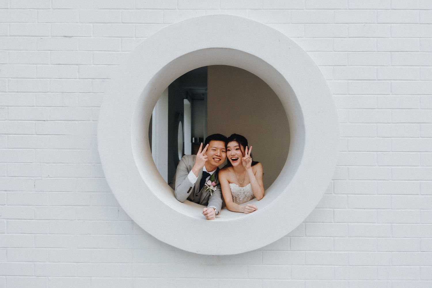 Modern white architectural spaces with oval-shaped window openings creating geometric compositions.