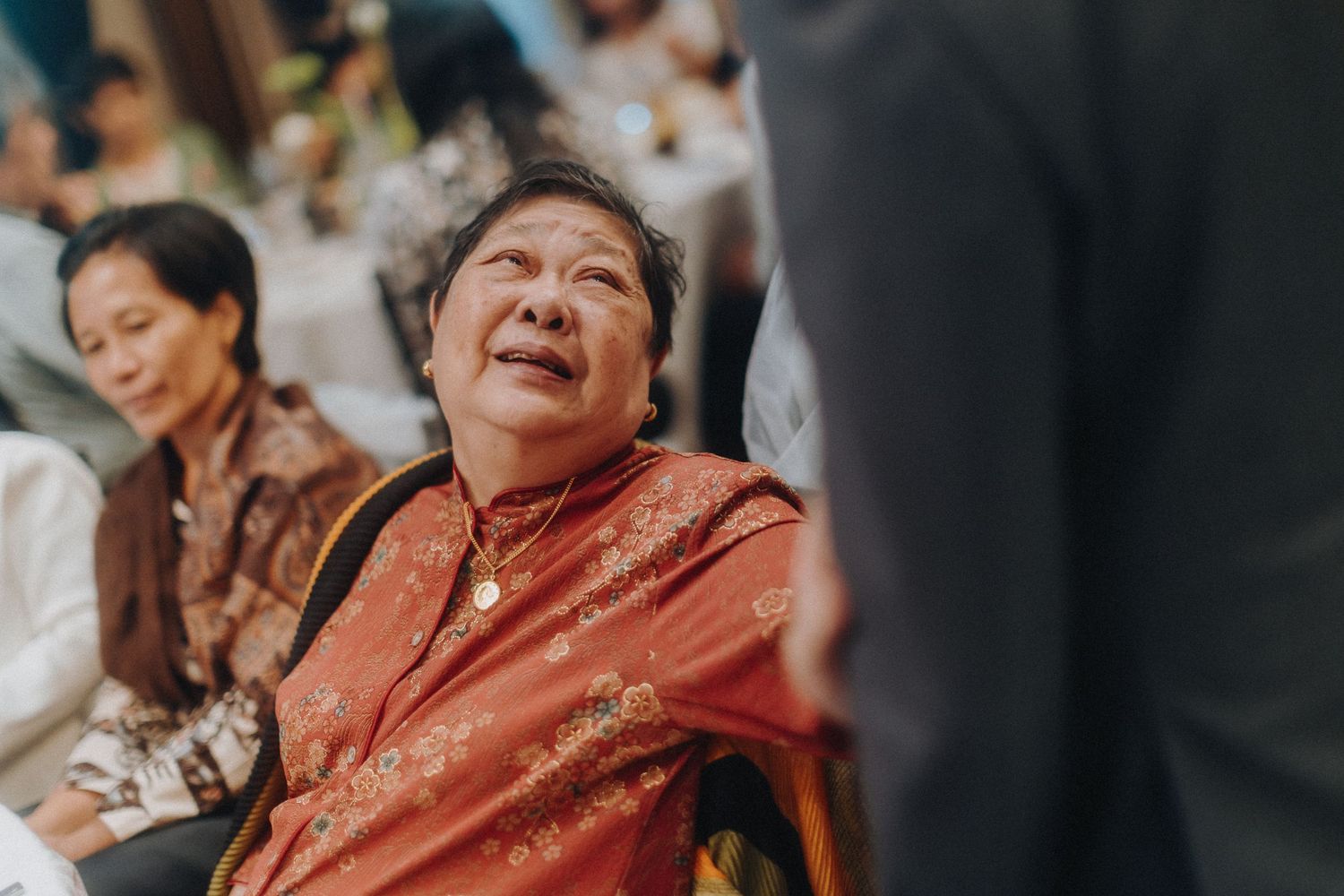 A heartfelt emotional moment captured during a wedding reception celebration.