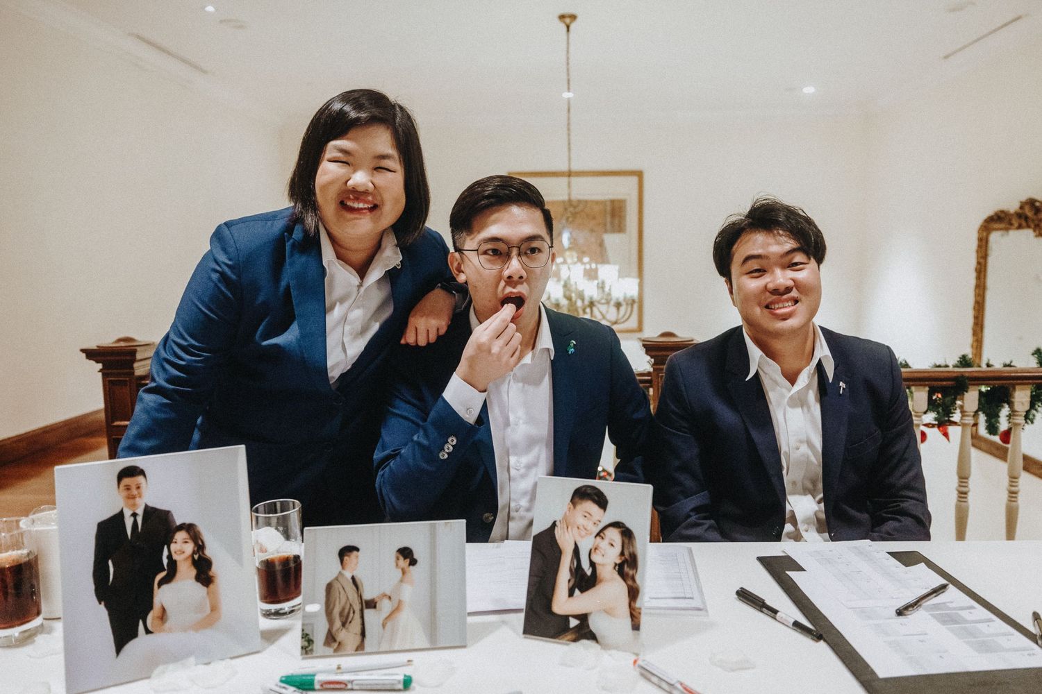 Candid scenes of people laughing and interacting around a long table during a celebration.