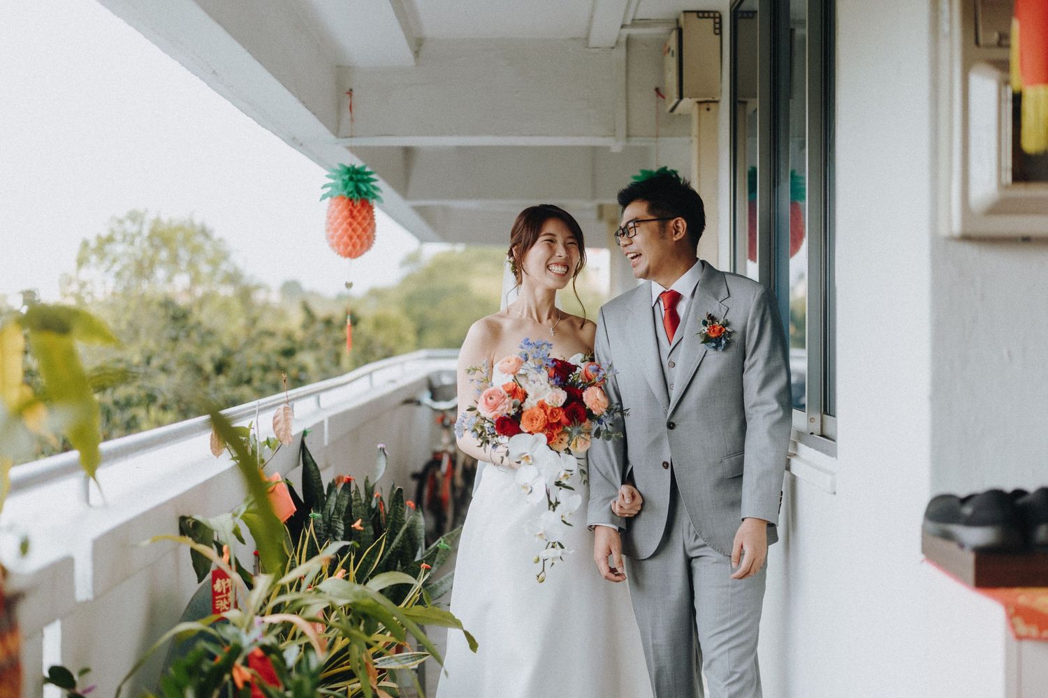 Outdoor wedding ceremony venue with Chinese lanterns and white floral decorations.
