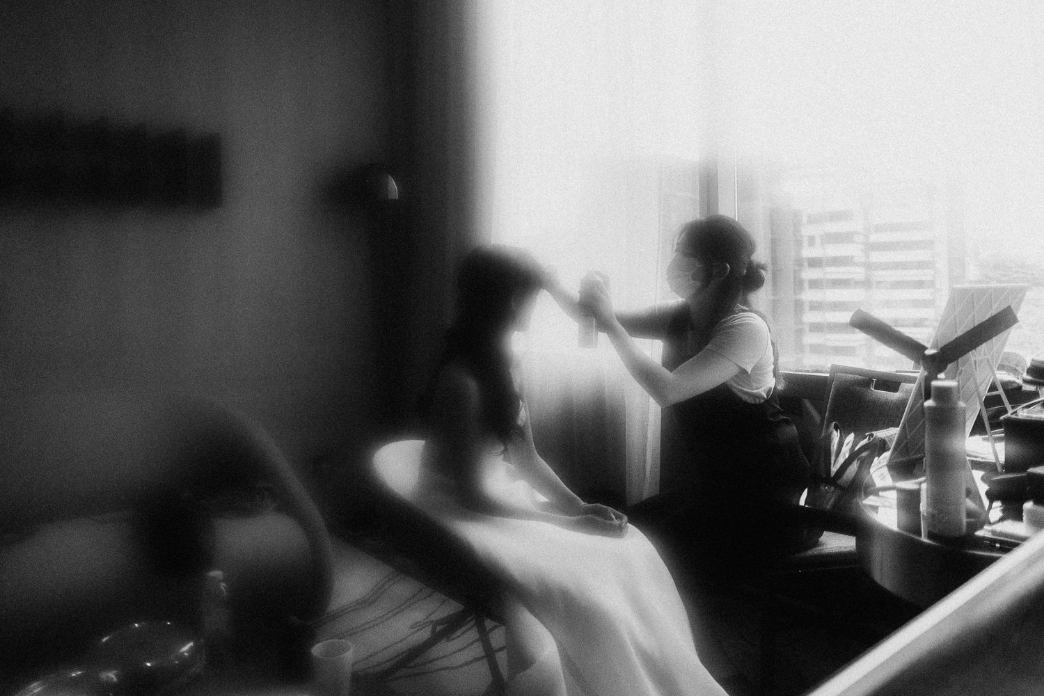 A black and white photo sequence showing silhouettes and office desk scenes with blurred edges and grainy texture.