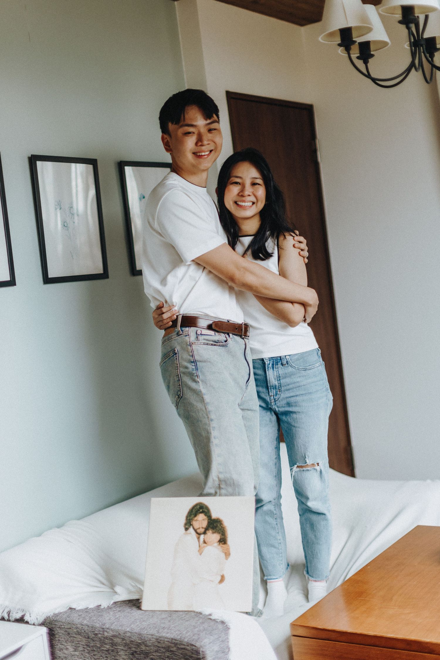 Casual lifestyle photoshoot in a bright, modern bedroom interior.