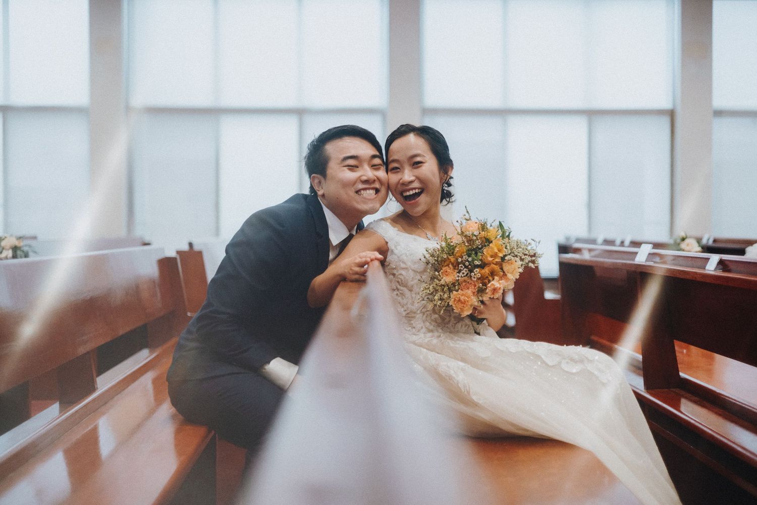 Elegant wedding reception setup in a bright modern room with natural lighting.