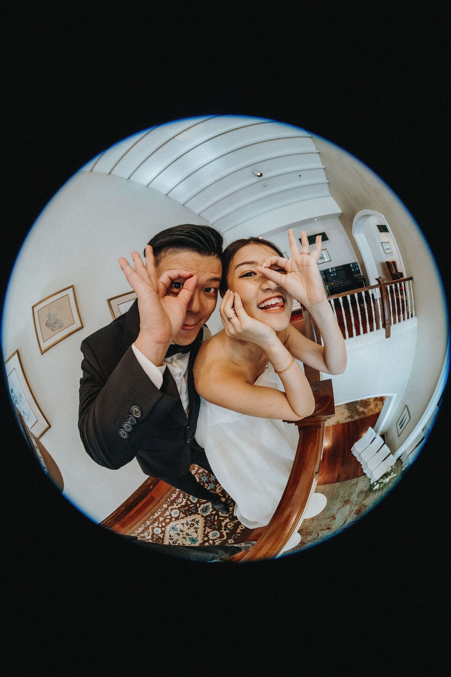 Playful fisheye lens wedding photos showing a couple and wedding party making funny faces and gestures.