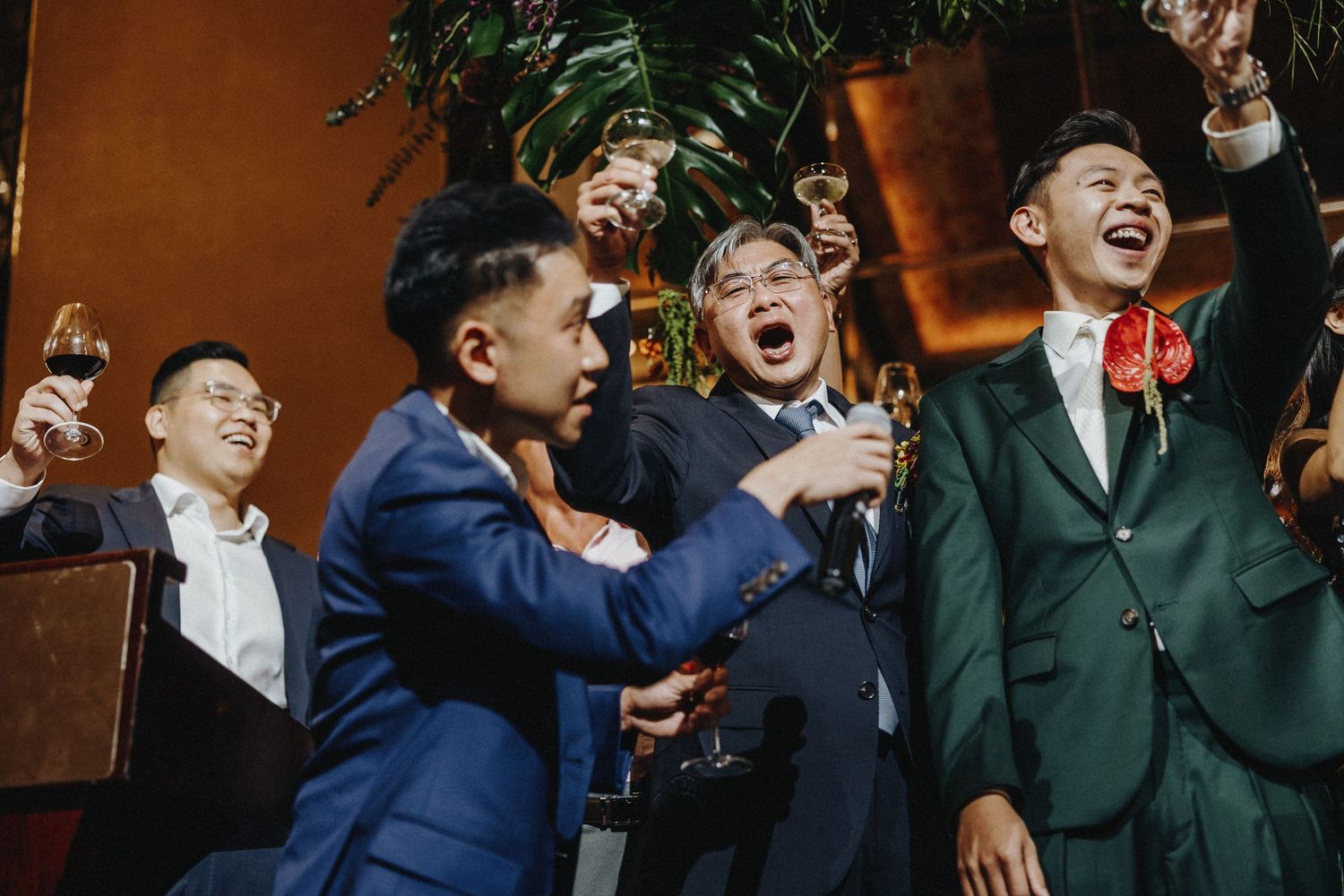Wedding guests reacting with excitement and joy during reception celebration.