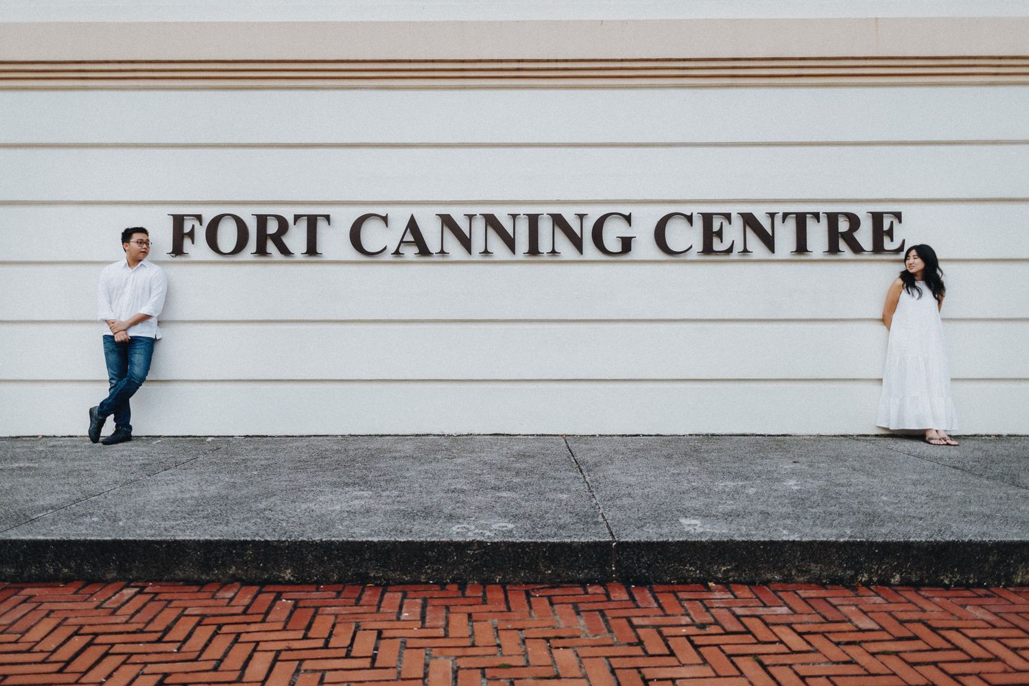 A series of artistic photos taken at Fort Canning Centre showing silhouettes against a white wall.