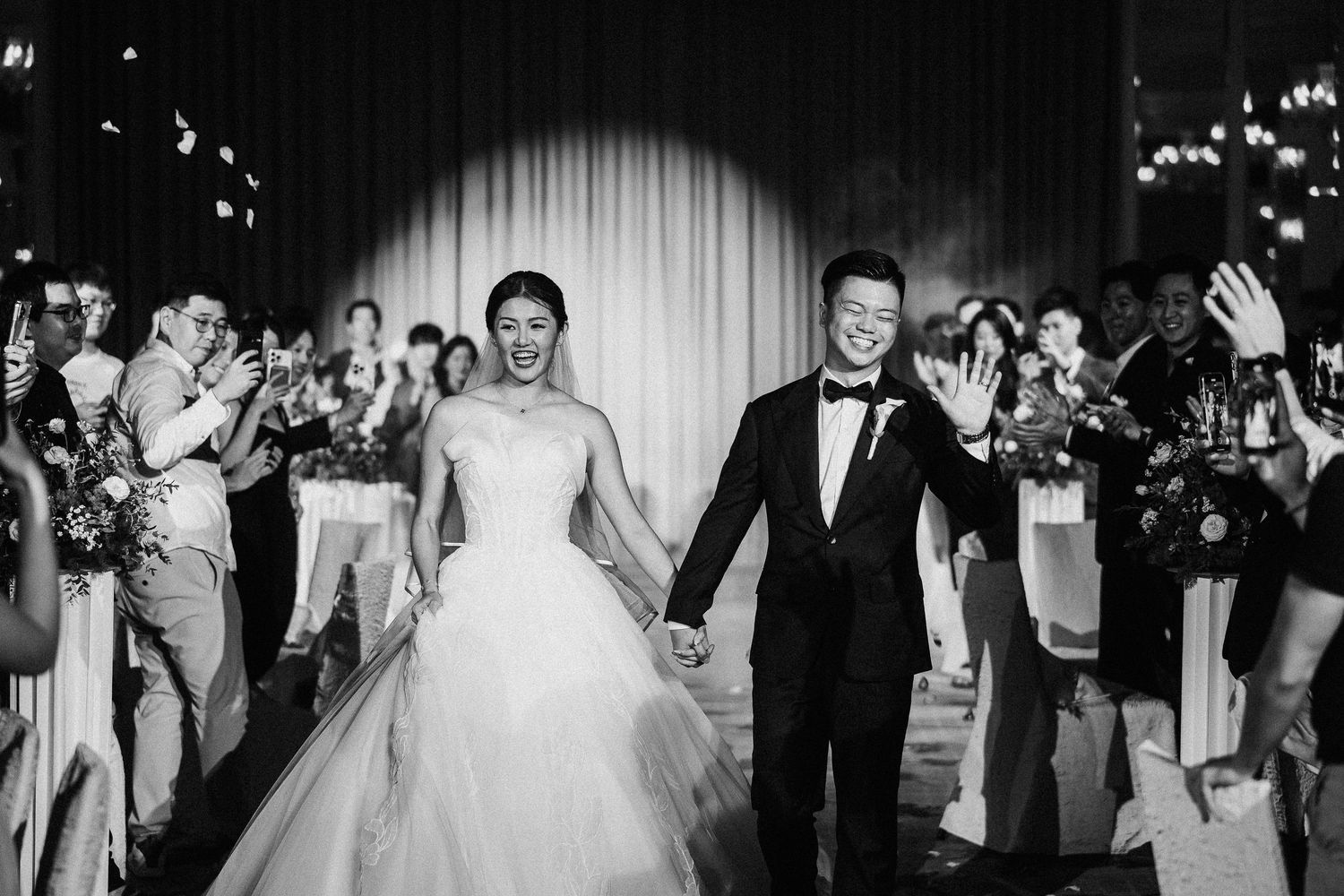 Black and white collage of wedding celebration moments showing dancing and festivities.