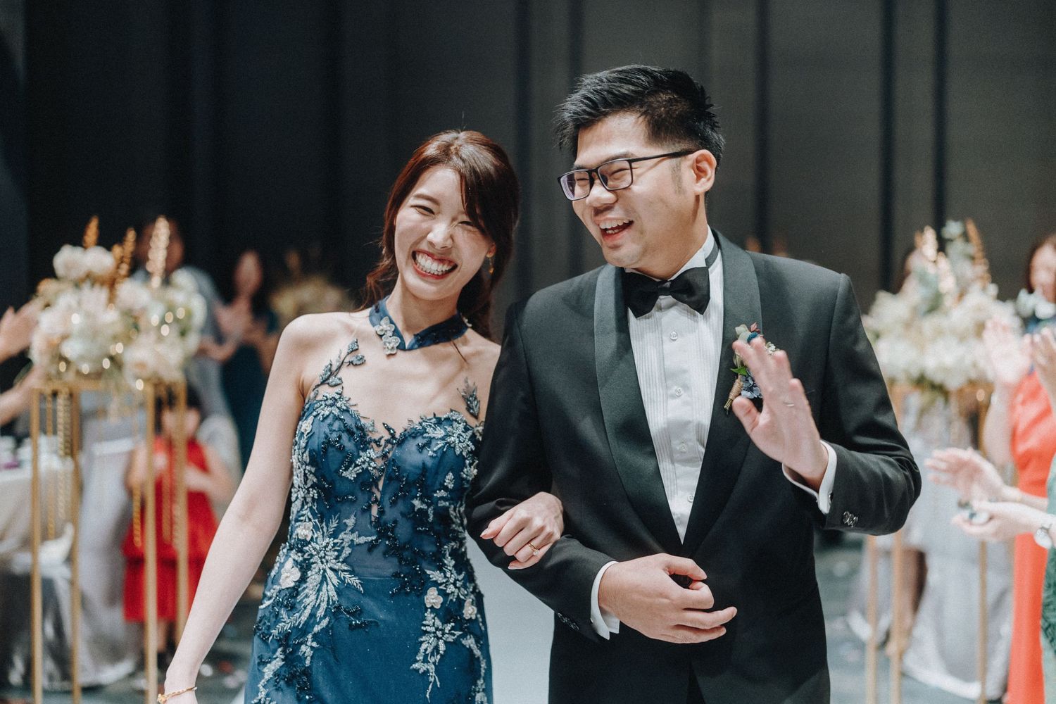 A collection of wedding photos in teal and navy showing happy moments between a couple at their celebration.