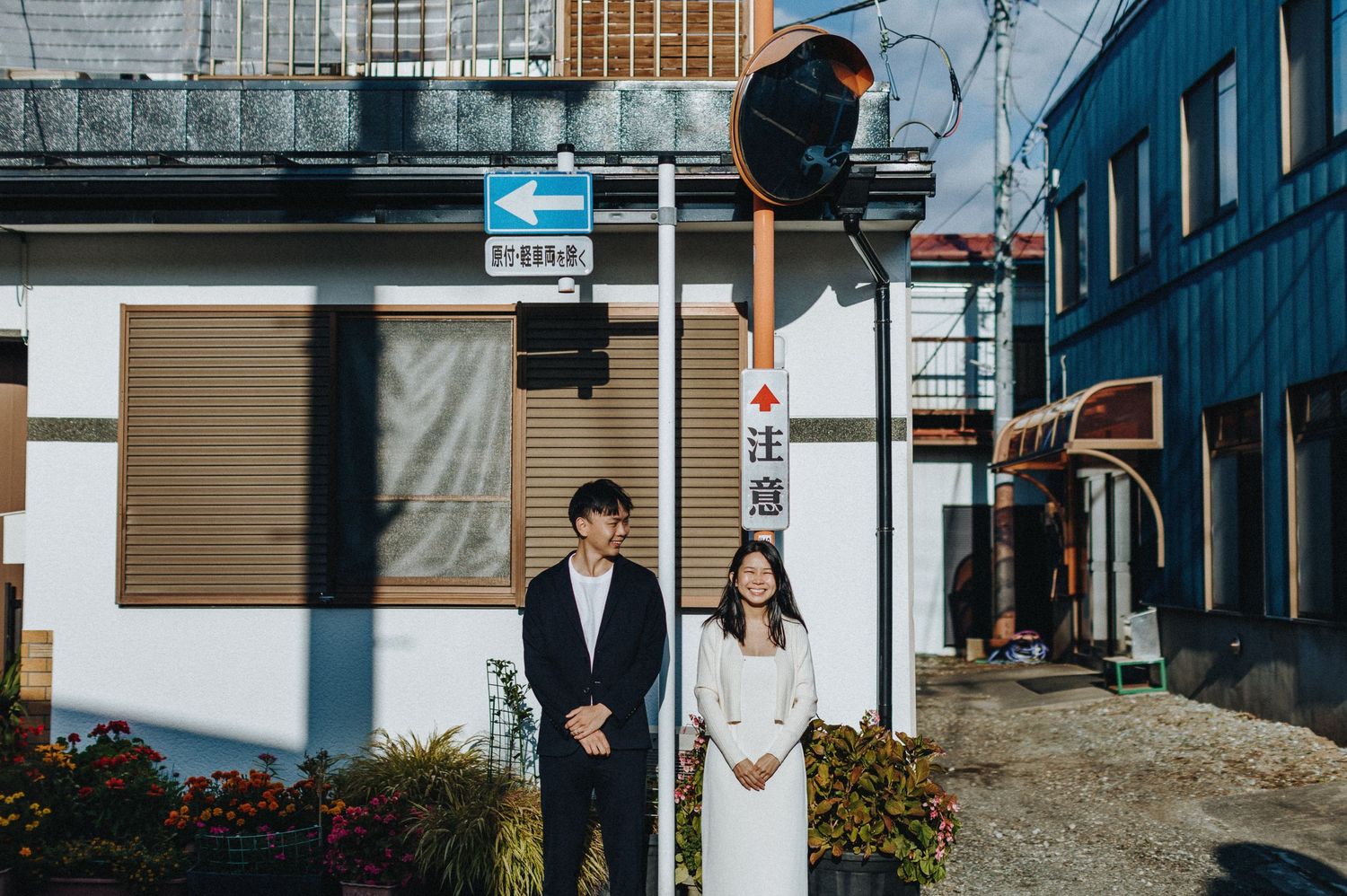Urban street scene with buildings and signage in Japanese style architecture.