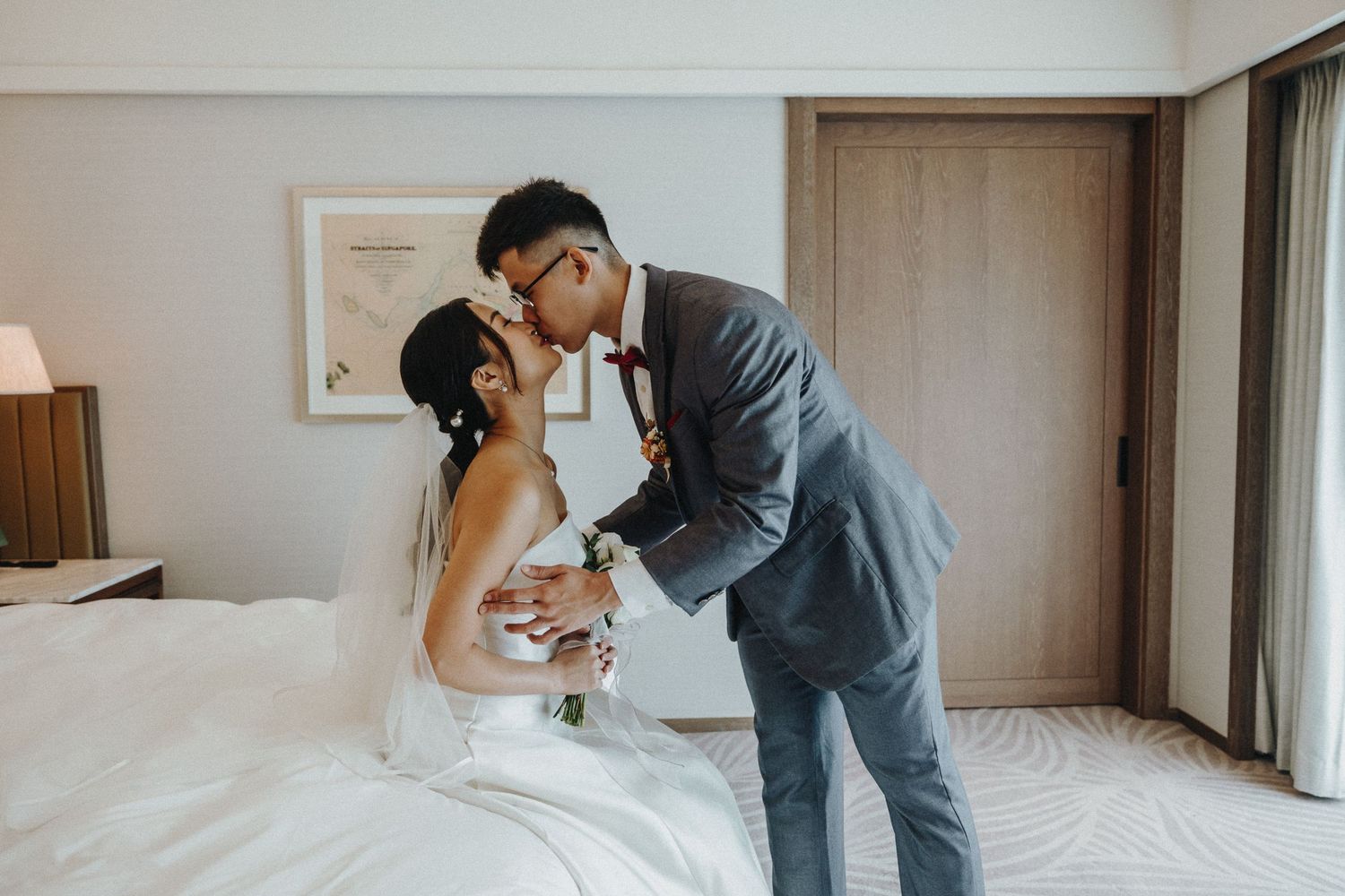 Modern hotel room interior with wedding preparations underway.